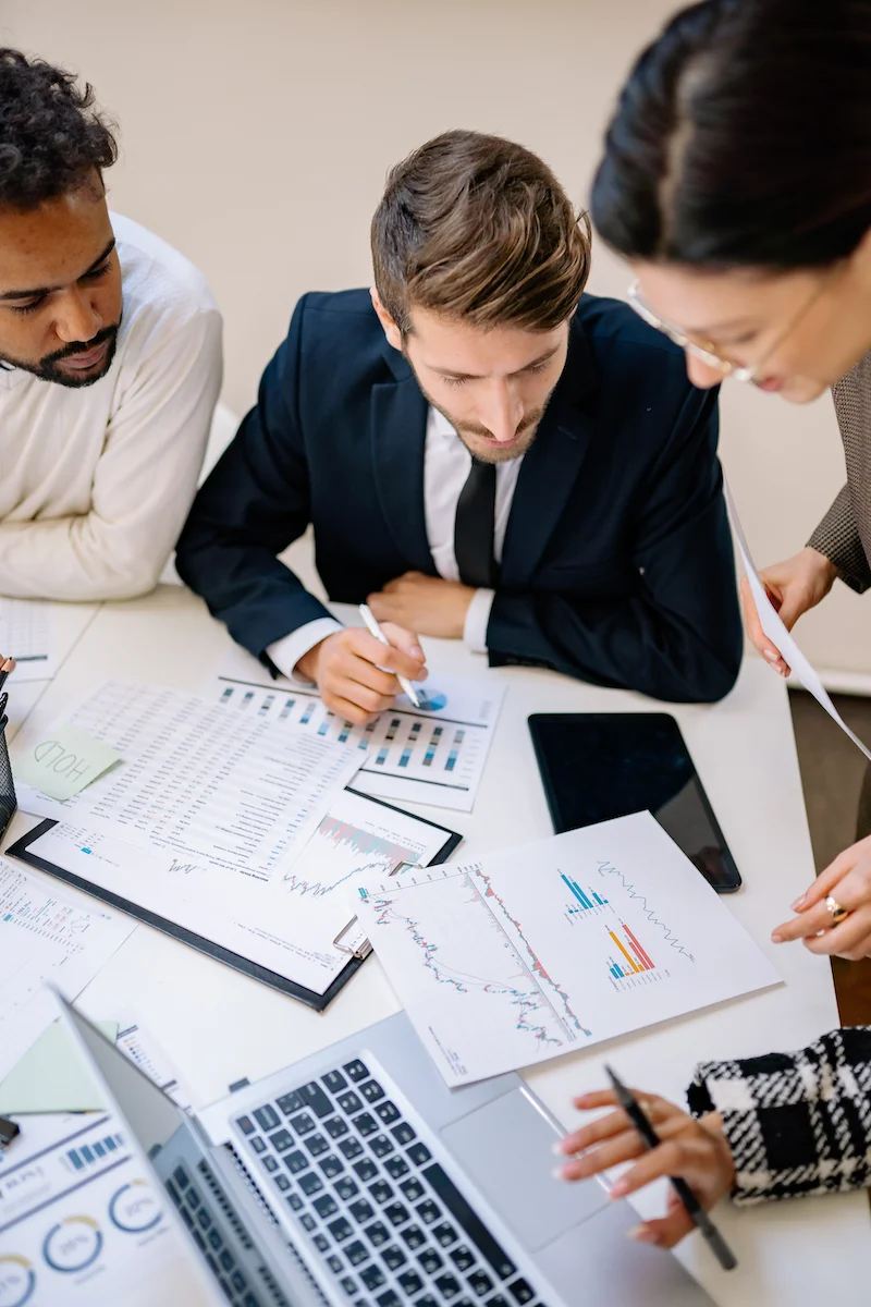A group of people reviewing financial dashboards
